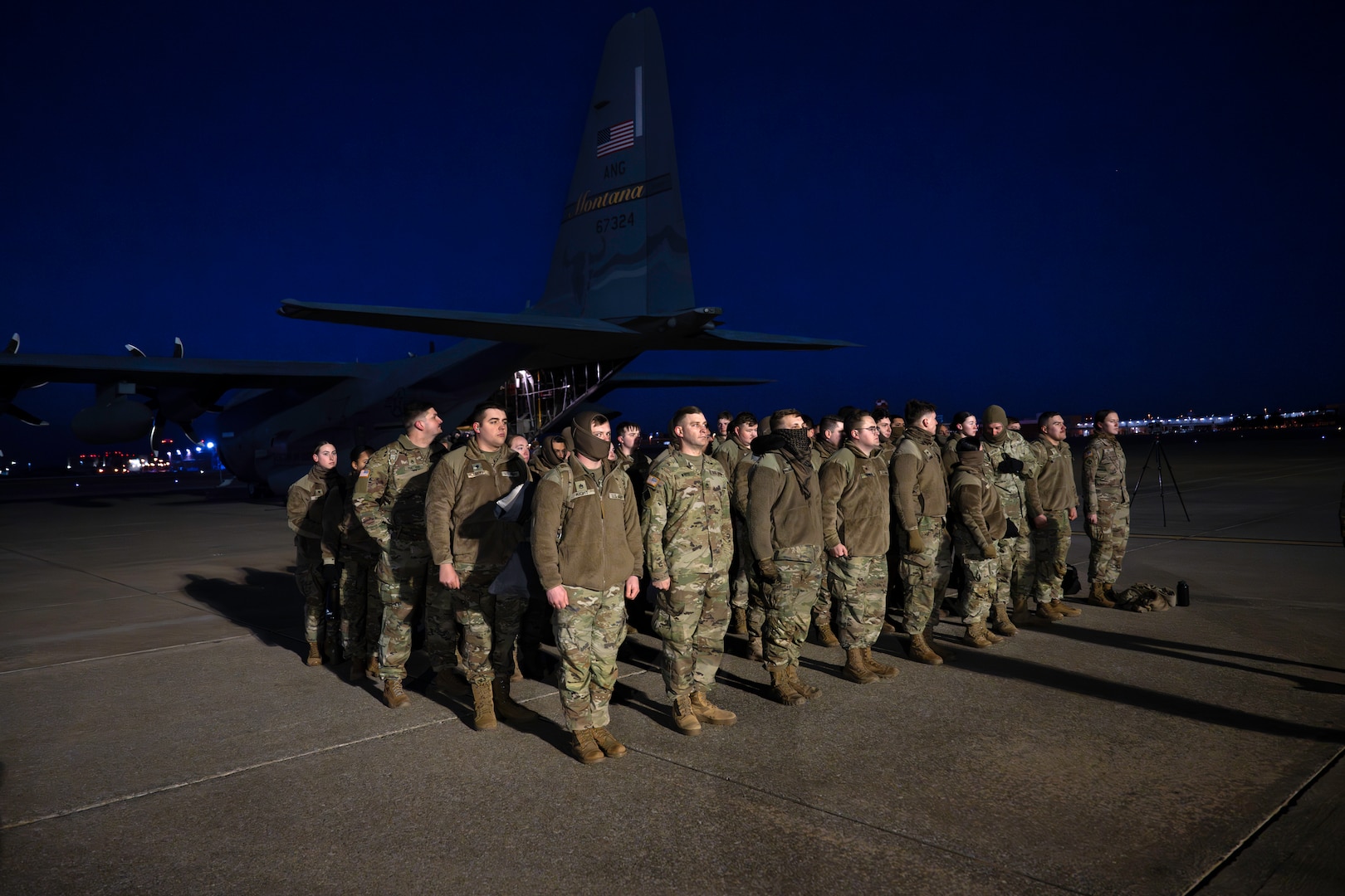 Oklahoma National Guard Soldiers board a C-130 at Will Rogers Air National Guard Base in Oklahoma City,  Jan 16, 2025. The Oklahoma Guardsmen join nearly 8,000 National Guard Soldiers and Airmen from approximately 40 states and territories to augment the District of Columbia National Guard. With a long-standing tradition of supporting presidential inaugurations, the National Guard plays a crucial role in balancing safety, security, and other duties during the peaceful transition of power (Oklahoma National Guard Photo by 1st Sgt. Mireille Merilice-Roberts).