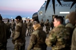 Oklahoma National Guard Soldiers board a C-130 at Will Rogers Air National Guard Base in Oklahoma City,  Jan 16, 2025. The Oklahoma Guardsmen join nearly 8,000 National Guard Soldiers and Airmen from approximately 40 states and territories to augment the District of Columbia National Guard. With a long-standing tradition of supporting presidential inaugurations, the National Guard plays a crucial role in balancing safety, security, and other duties during the peaceful transition of power (Oklahoma National Guard Photo by 1st Sgt. Mireille Merilice-Roberts).