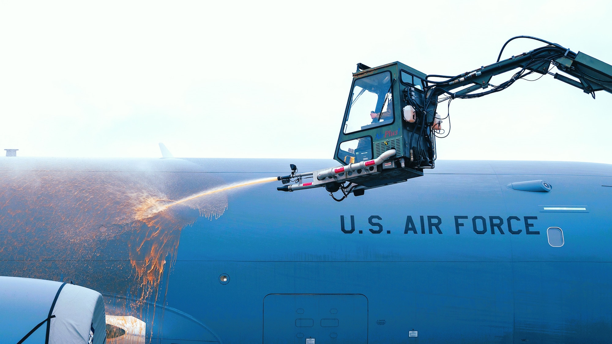 U.S. Air Force Senior Airman Jared de Bellefeuille, 605th Aircraft Maintenance Squadron crew chief, sprays de-icing fluid on a KC46A Pegasus aircraft at Joint Base McGuire-Dix-Lakehurst, N.J, Jan. 13, 2025. The 605th AMXS is responsible for de-icing the aircraft to remove the build-up of frost and ice, preventing the loss of lift and damage to aircraft components. (U.S. Air Force photo by Susan Moriarty)