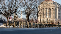 Airmen march into cordon position