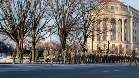 Airmen march into cordon position