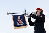 A trombonist plays their instrument
