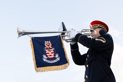 A trombonist plays their instrument