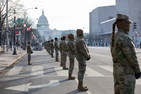 Airmen stand in cordon position with U.S. Capitol in the background