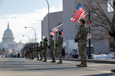 Airmen stand in cordon position