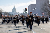 The U.S. Army Band "Pershing's Own" marches with U.S. Capitol in the background