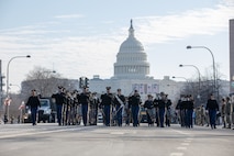 U.S. Army Old Guard Fife and Drum Corps marches with U.S. Capitol in the background