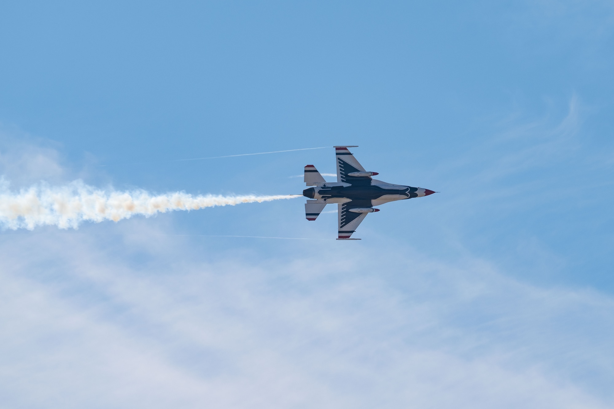 A F-16 Fighting Falcon assigned to the United States Air Force Air Demonstration Squadron "Thunderbirds" conducts a site survey over Dyess Air Force Base, Texas, Jan. 15, 2025, for the upcoming airshow in April. Dyess is hosting the “Wings Over West Texas” airshow on April 19 and 20 to celebrate West Texas heritage alongside the best of America’s Lift and Strike base. (U.S. Air Force Senior Airman Emma Anderson)