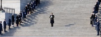 Service member standing on stairs at U.S. Capitol
