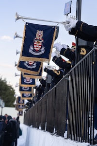 A line of banners from the U.S. Army Band "Pershing's Own" hang off of instruments