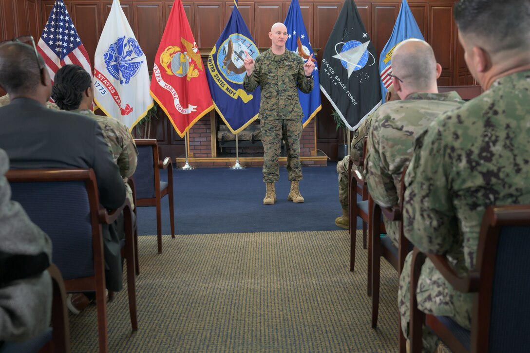 Senior Enlisted Advisor to the Chairman of the Joint Chiefs of Staff Marine Corps Sgt. Maj. Troy E. Black speaks with agency employees during an All-Hands
