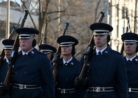 Guardians march while holding rifles