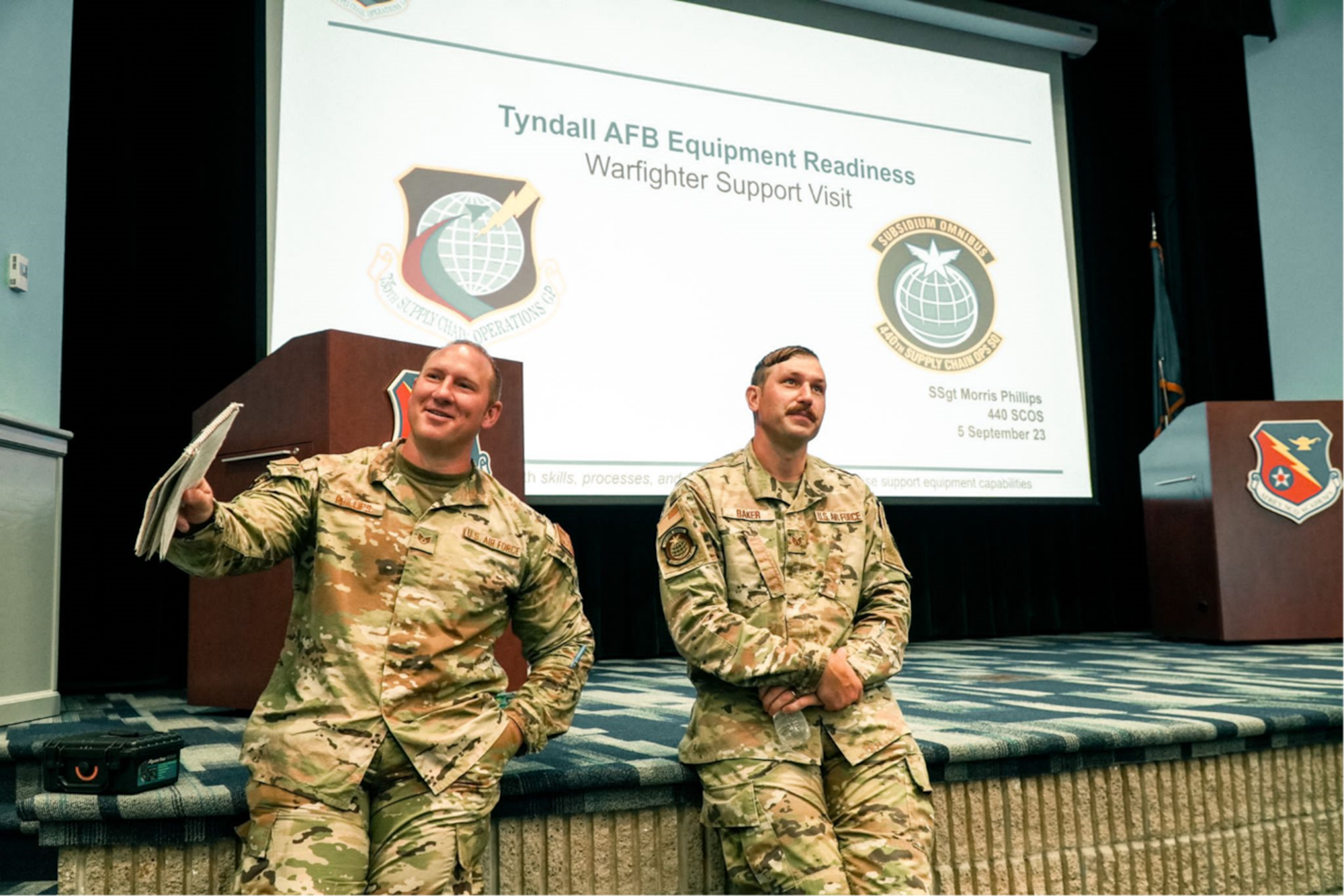 Two men in military uniforms instructing a class.