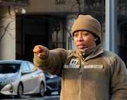 Soldier pointing at something in the distance