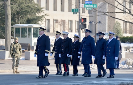 Small group of service members lead the parade