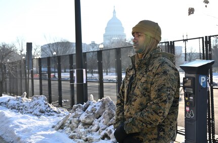 A Marine stands in cordon with U.S. Capitol in the background