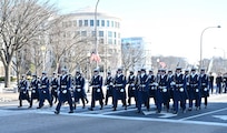 Coast Guard members march in a parade