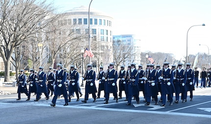 Coast Guard members march in a parade