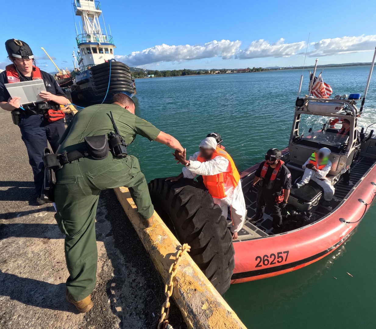 U.S. Border Patrol and Homeland Security Investigations agents in Mayaguez, Puerto Rico, receive custody of four migrants from a Coast Guad boat crew, following the interdiction of an unlawful irregular migration voyage off, Puerto Rico, Jan. 13, 2025. The migrants face possible federal prosecution by the U.S. Attorney’s Office for the District of Puerto Rico on charges of attempt to illegally reenter the United States in violation of Title 8 U.S.C. Section 1326, and failure to heave in violation of Title 18 U.S.C. Section 2237. (U.S. Coast Guard photo)