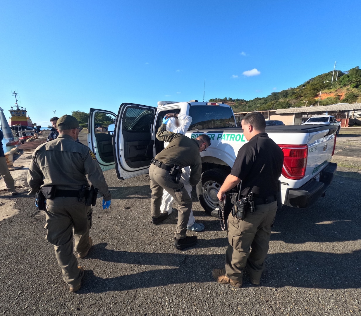 U.S. Border Patrol and Homeland Security Investigations agents in Mayaguez, Puerto Rico, receive custody of four migrants from a Coast Guad boat crew, following the interdiction of an unlawful irregular migration voyage off, Puerto Rico, Jan. 13, 2025. The migrants face possible federal prosecution by the U.S. Attorney’s Office for the District of Puerto Rico on charges of attempt to illegally reenter the United States in violation of Title 8 U.S.C. Section 1326, and failure to heave in violation of Title 18 U.S.C. Section 2237. (U.S. Coast Guard photo)