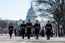 Soldiers march with U.S. Capitol in the background