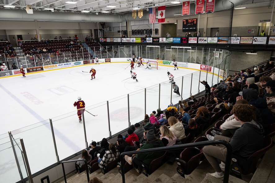 Airmen, family members, and fans watch the Minot State University Beavers and Iowa State University Cyclones hockey teams compete during the MSU military appreciation hockey game at Maysa Arena, Minot, North Dakota, Jan. 11, 2025. The game was free to attend for all military members and their families. (U.S. Air Force photo by Senior Airman Kyle Wilson)