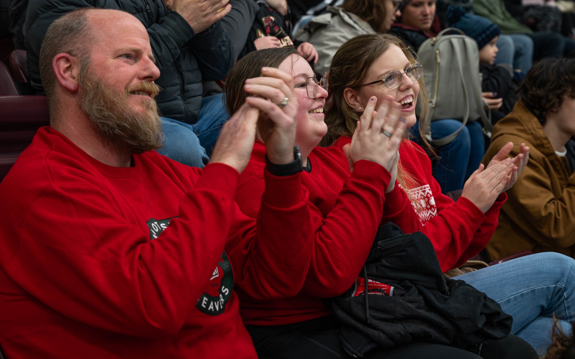 Minot State University Beavers fans cheer during the MSU military appreciation hockey game at Maysa Arena, Minot, North Dakota, Jan. 11, 2025. At the time of this game, the Beavers were the #2 nationally ranked team in Division I of the American Collegiate Hockey Association. (U.S. Air Force photo by Senior Airman Kyle Wilson)