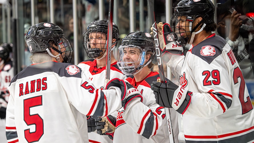 Minot State University Beavers players celebrate after scoring a goal during the MSU military appreciation hockey game at Maysa Arena, Minot, North Dakota, Jan. 11, 2025. The Beavers displayed camaraderie and teamwork throughout the game, which led to a 12-3 victory. (U.S. Air Force photo by Senior Airman Kyle Wilson)