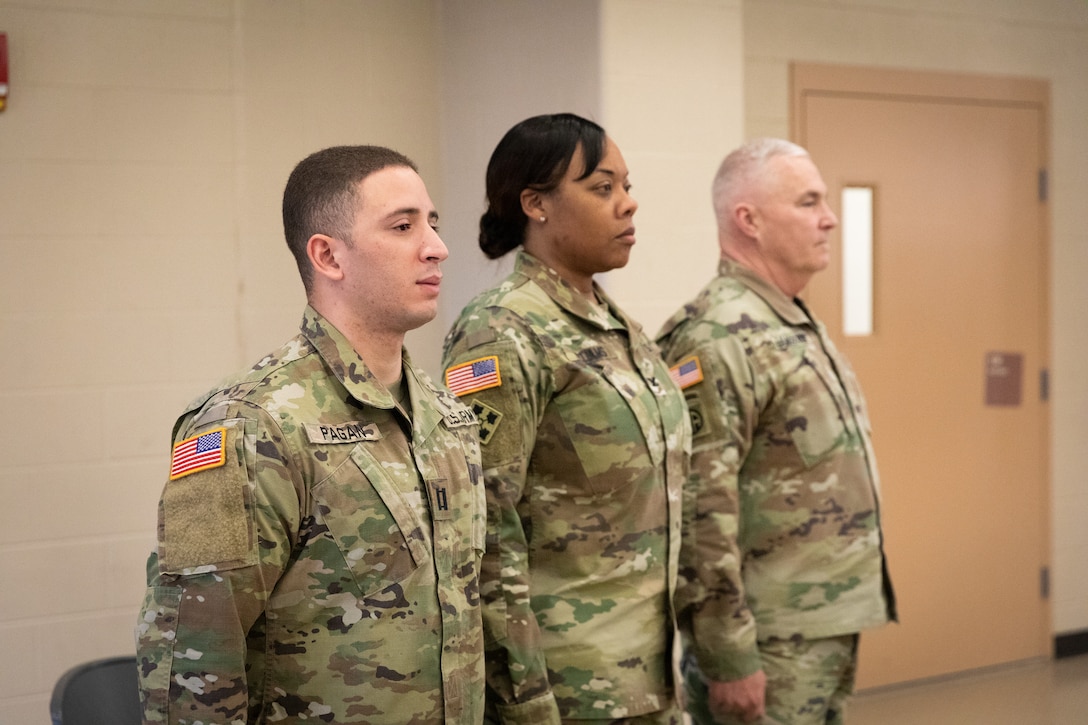 U.S. Army Capt. Angel Pagan, commander of the 617th Military Police Company, 149th Maneuver Enhancement Brigade stands with Col. Brandye Williams, commander of the 149th MEB, and Maj. Gen. Haldane Lamberton, Kentucky adjutant general, at the deployment ceremony at the Armed Forces Reserve Center in Richmond, Kentucky on Jan. 4, 2025.