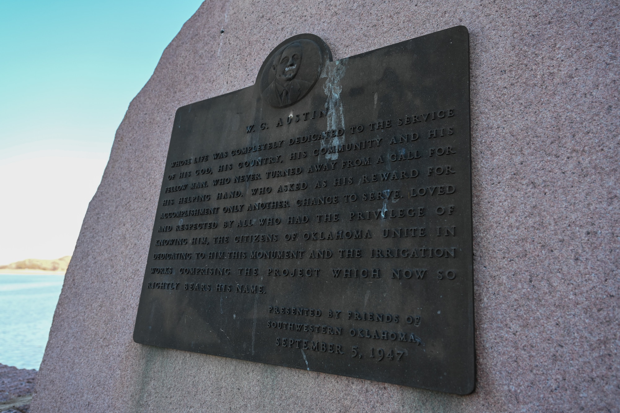 A monument sits near the Lake Altus-Lugert dam in dedication to W.C. Austin at Lake Altus-Lugert, Oklahoma, Jan. 15, 2025. Austin dedicated years of his life to his community and the local irrigation system is now named after him. (U.S. Air Force Photo by Airman 1st Class Jonah Bliss)