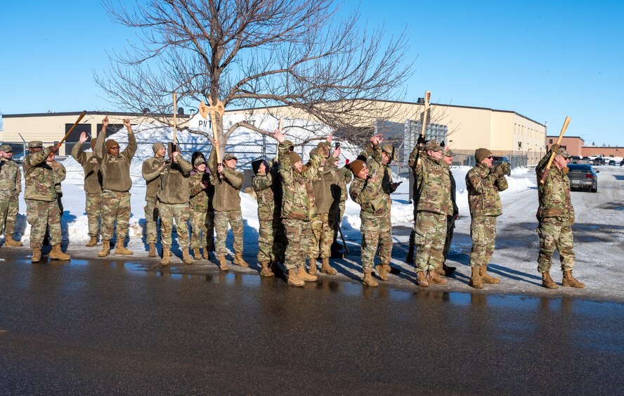 Airmen assigned to the 91st Missile Wing gather to watch a transporter erector return from a Minuteman III ICBM launch facility at Minot Air Force Base, North Dakota, Jan. 15, 2025. The old transporter erector systems are being replaced due to the increasing age of the system and the scarcity of parts needed for repair of the unit. (U.S. Air Force photo by Staff Sgt. Brendan Miller)