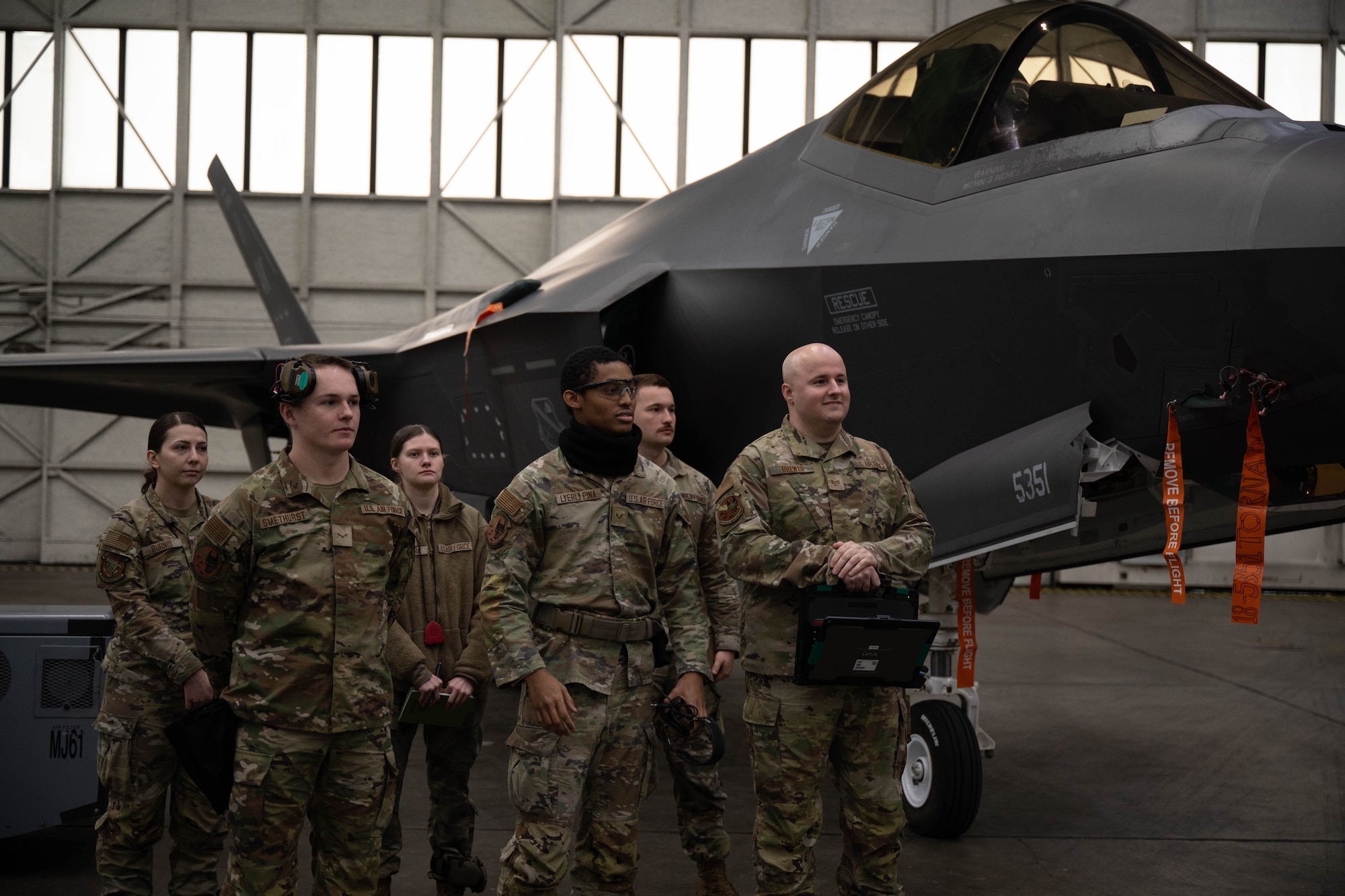 U.S. Air Force Airmen from the 356th Fighter Generation Squadron stand during the fourth quarter load competition