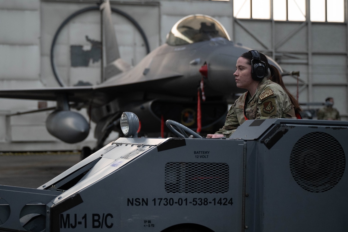 U.S. Air Force Senior Airman drives a MJ-1 lift truck during the fourth quarter load competition