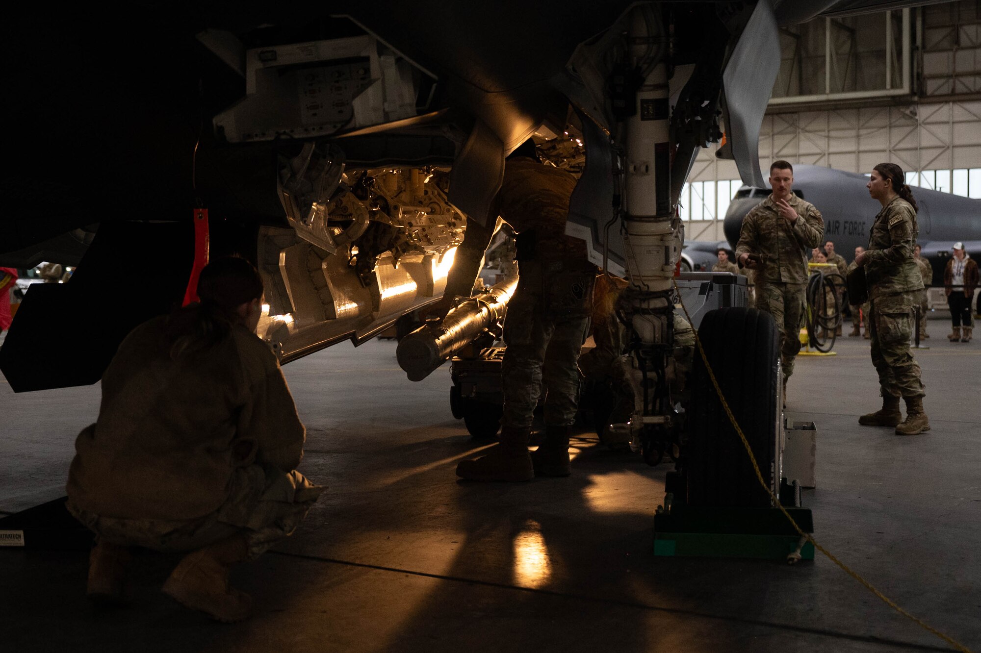 U.S. Air Force Airmen prepare to load an AIM-120 Advanced Medium Range Air-to-Air Missile into a F-35A Lightning II during the fourth quarter load competition