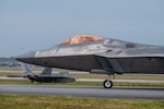 U.S. Air Force F-22A Raptors assigned to the 525th Expeditionary Fighter Squadron taxi down the runway during a base-wide readiness exercise at Kadena Air Base, Japan, Jan. 15, 2025. The transition to more modern aircraft at Kadena exemplifies the U.S. Air Force’s continued commitment to enhancing posture and building on the strong foundation of the U.S.-Japan alliance. (U.S. Air Force photo by Airman 1st Class Arnet Shayne Tamayo)