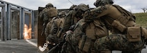 U.S. Marines with Battalion Landing Team 2/4, 31st Marine Expeditionary Unit, detonate an explosive charge during an urban breaching range on Camp Hansen, Okinawa, Japan, Jan. 7, 2025.