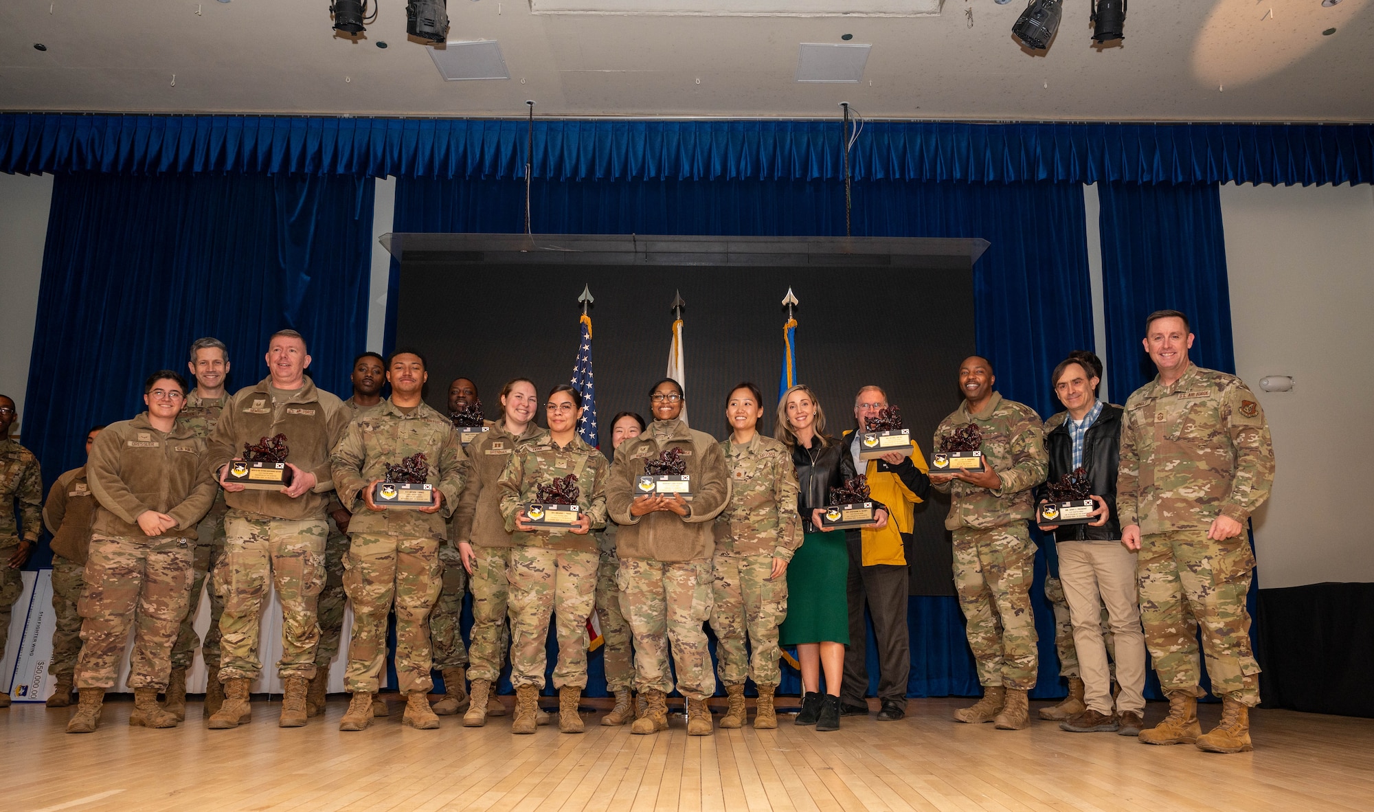 The 51st Fighter Wing 4th Quarter Award winners pose for a group photo at Osan Air Base, Republic of Korea, Jan. 16, 2025. The awards ceremony recognizes outstanding performers throughout the wing supporting the “Fight Tonight” mission. (U.S. Air Force photo by Staff Sgt. Christopher Tam)