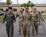 Chief Master Sgt. of the Air Force David Flosi walks with Col. Brandon M. Kelly, 482d Fighter Wing commander.