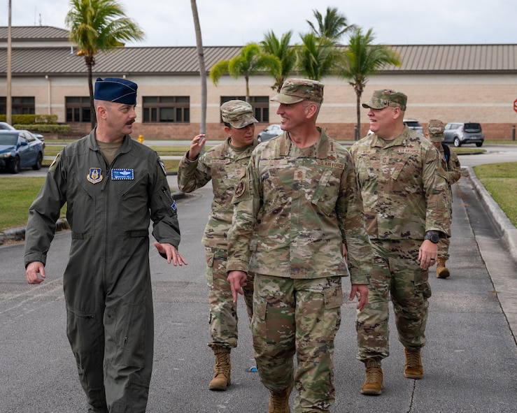 Chief Master Sgt. of the Air Force David Flosi walks with Col. Brandon M. Kelly, 482d Fighter Wing commander.