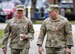 Chief Master Sgt. of the Air Force David Flosi walks with Chief Master Sgt. Jeremy Allen