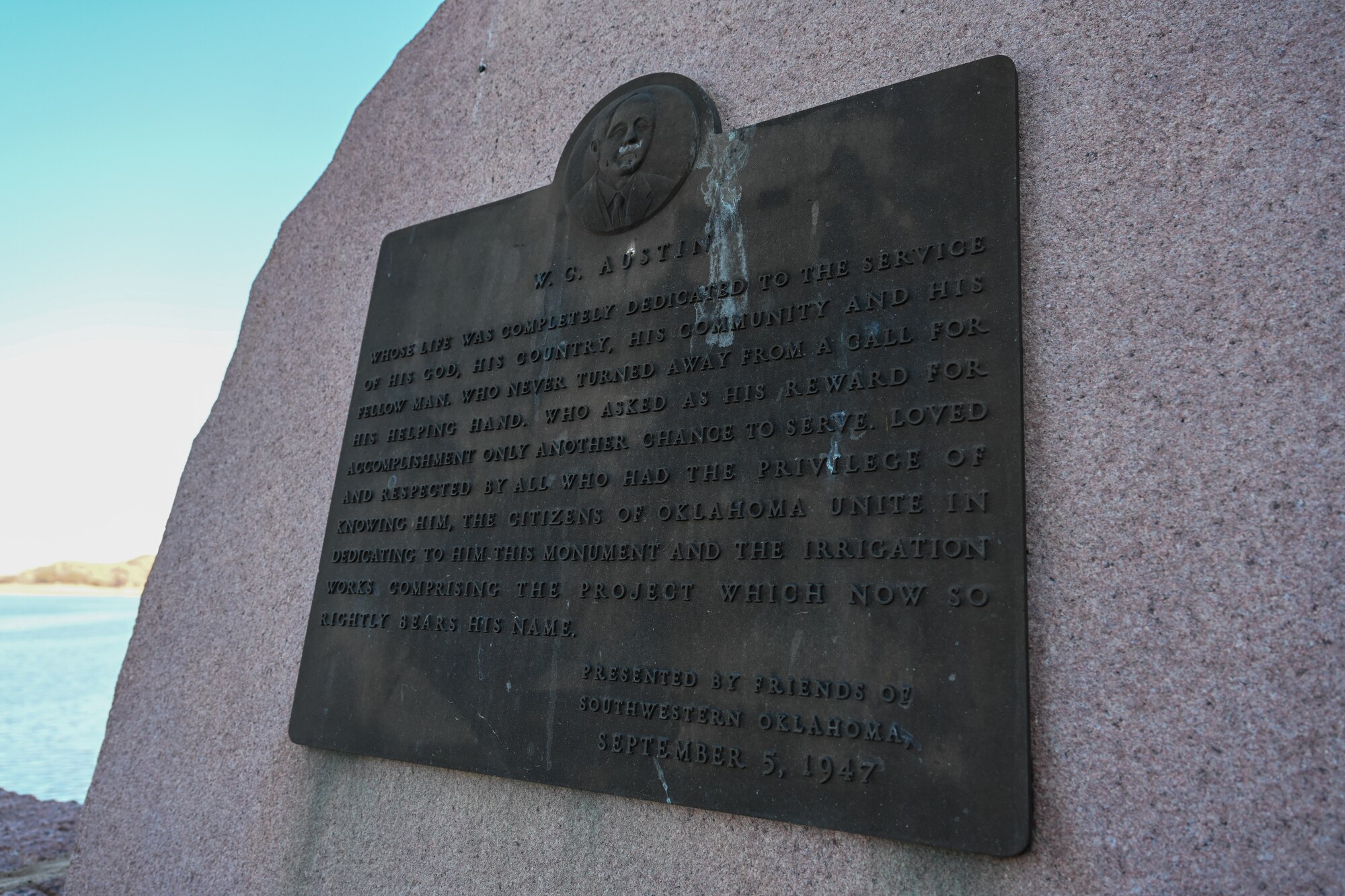 A monument sits near the Lake Altus-Lugert dam in dedication to W.C. Austin at Lake Altus-Lugert, Oklahoma, Jan. 15, 2025. Austin dedicated years of his life to his community and the local irrigation system is now named after him. (U.S. Air Force Photo by Airman 1st Class Jonah Bliss)