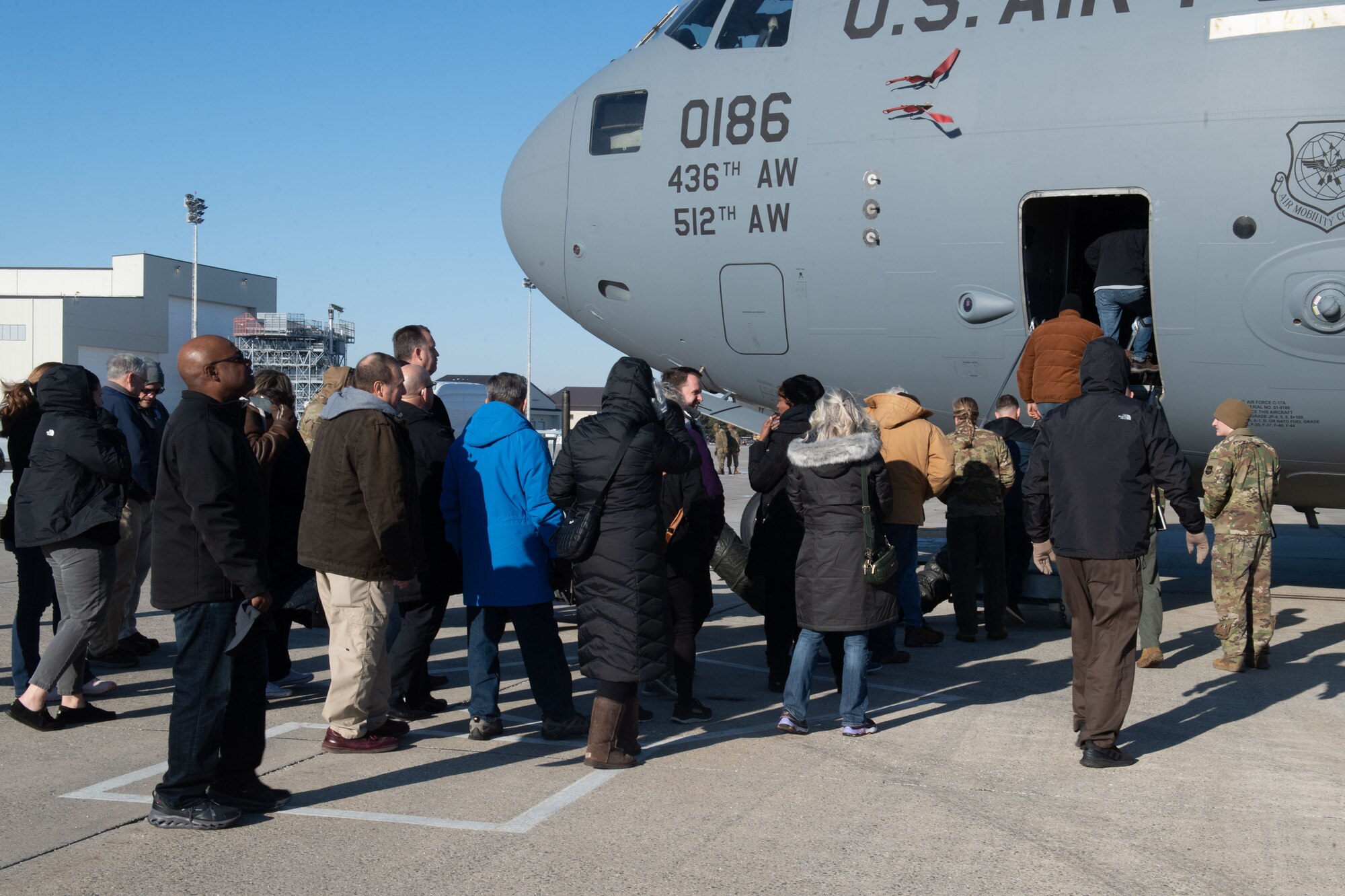 Honorary commander enter aircraft