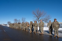 Airmen assigned to the 91st Missile Wing line up to welcome a transporter erector back from a Minuteman III ICBM launch facility at Minot Air Force Base, North Dakota, Jan. 15, 2025. This was the last maintenance mission for the old systems before they are replaced by newer models. (U.S. Air Force photo by Staff Sgt. Brendan Miller)