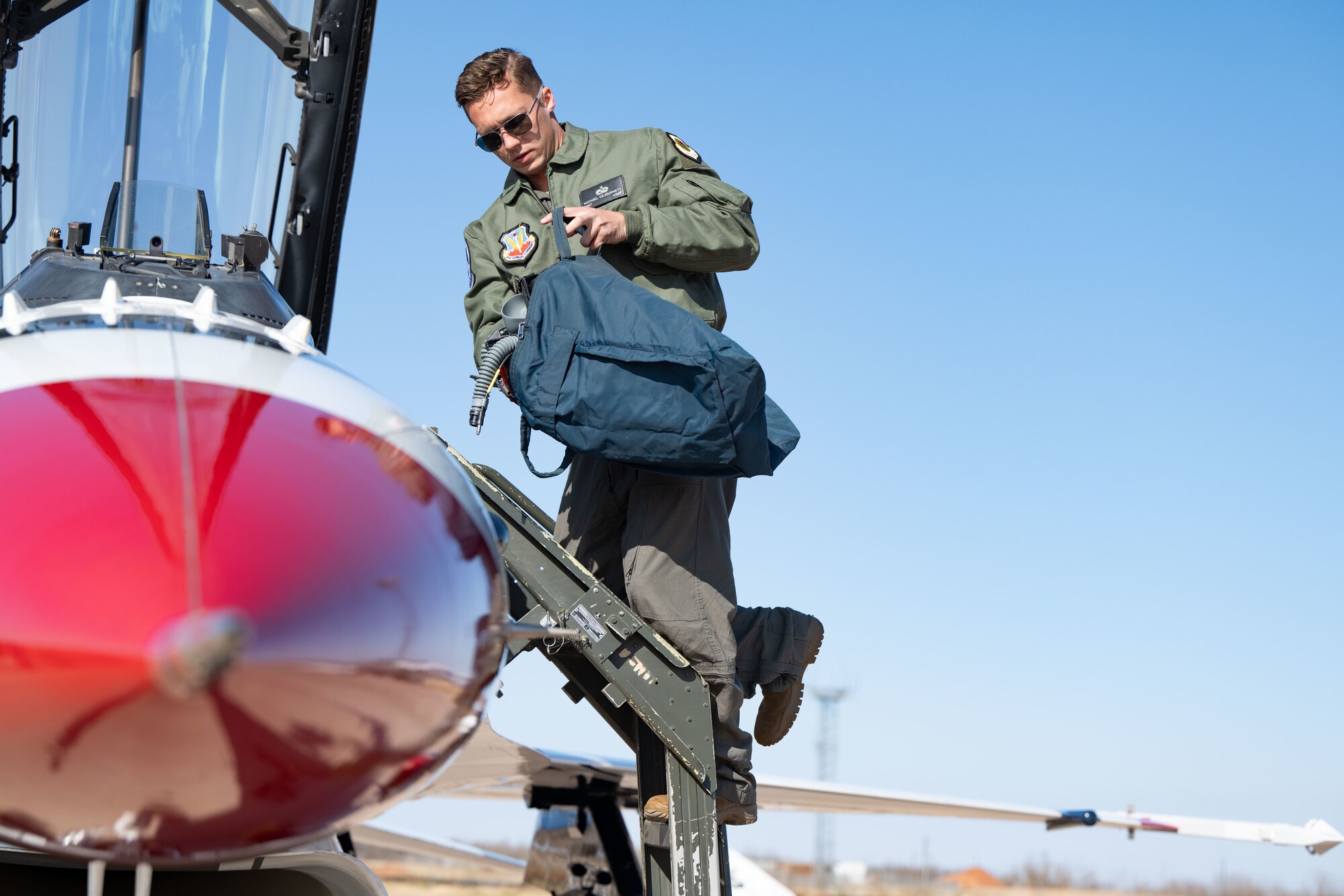 U.S. Air Force Staff Sgt. Michael DeJournett, USAF Thunderbird 8 dedicated crew chief unloads gear from a F-16 Fighting Falcon at Dyess Air Force Base, Texas, Jan. 15, 2024. The Thunderbirds will be performing at the upcoming “Wings Over West Texas” airshow alongside displays that showcase West Texas heritage, honoring our heritage while showcasing the capabilities that will carry us into the future. (U.S. Air Force photo by Airman 1st Class Emma Anderson)