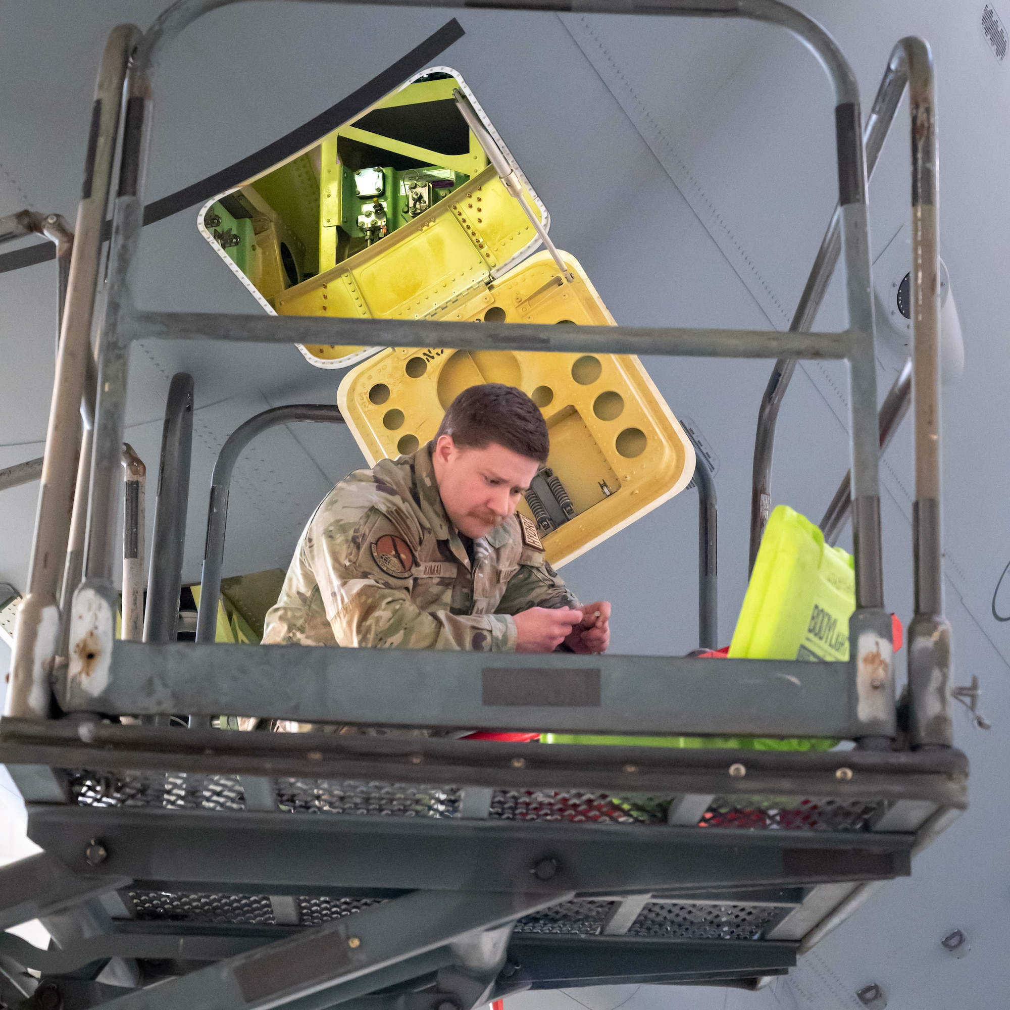 U.S. Air Force Staff Sgt. Jeremy Kamai, 605th Aircraft Maintenance Squadron hydraulics craftsman, selects tools required for a latch removal job on the KC-46A Pegasus aircraft at Joint Base McGuire-Dix-Lakehurst, N.J., Jan. 14, 2025. The 605th AMXS is responsible for flight line maintenance, inspection and repair efforts that keep the KC-46A flying and ready to perform its mission. (U.S. Air Force photo by Susan Moriarty)