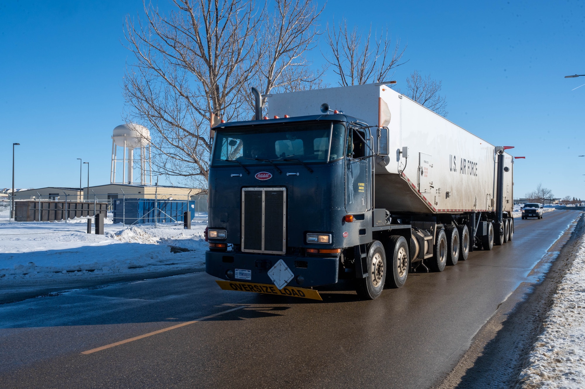 Airmen assigned to the 91st Missile Wing welcome a transporter erector back from performing maintenance on a Minuteman III ICBM at Minot Air Force Base, North Dakota, Jan. 15, 2025. The old models of the transporter erector have been in use for 37 years and will soon be replaced by newer models that can continue to support missile maintenance and readiness more effectively. (U.S. Air Force photo by Staff Sgt. Brendan Miller)