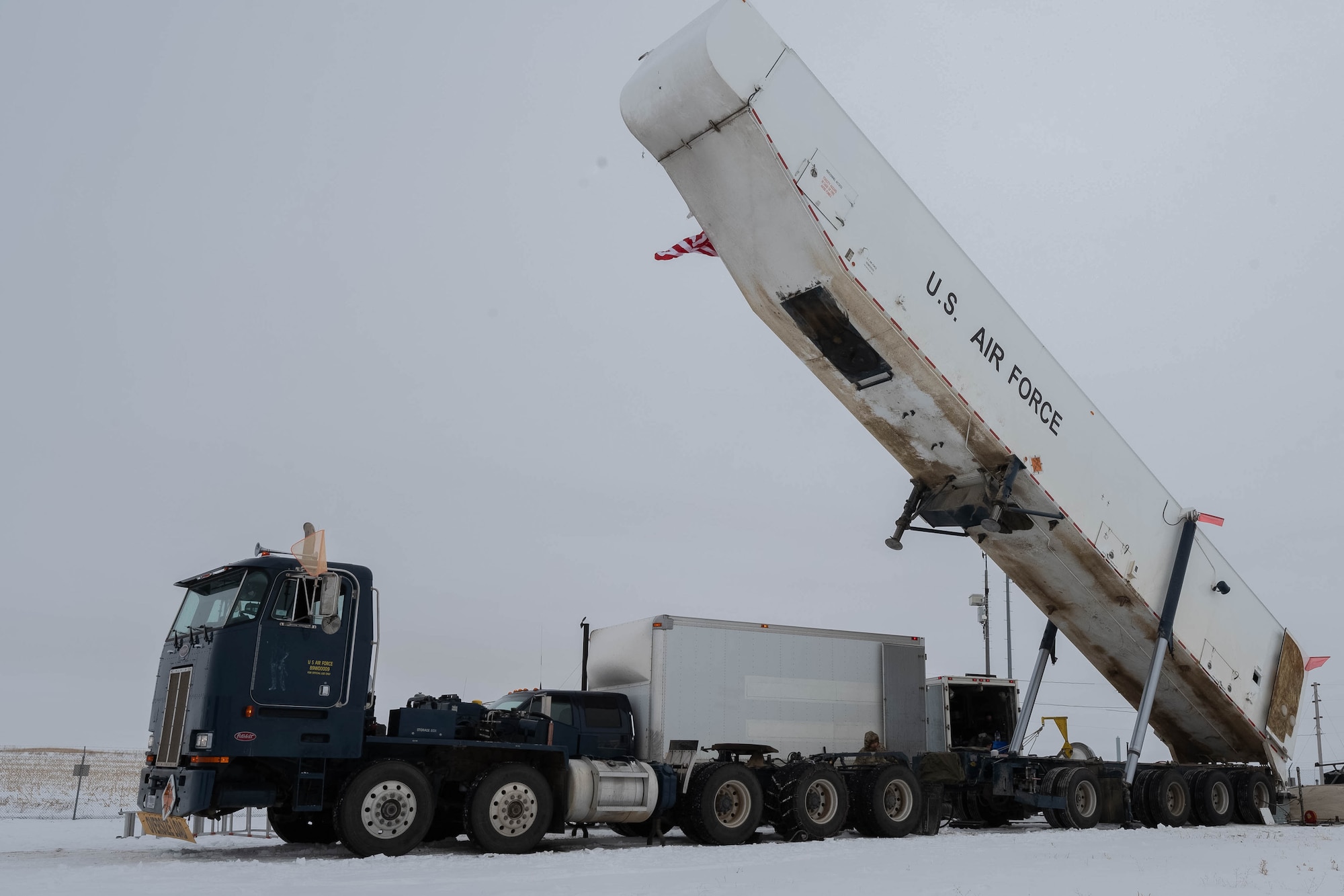 Airmen assigned to the 91st Missile Maintenance Squadron use a transporter erector to accomplish Minuteman III missile maintenance at Minot Air Force Base, North Dakota, Jan. 14, 2025. The transporter erector has been a piece of equipment used since its creation in the late 1980s and has served as a reliable and efficient way of performing missile maintenance and transport. (U.S. Air Force photo by Airman 1st Class Wesley Davies)