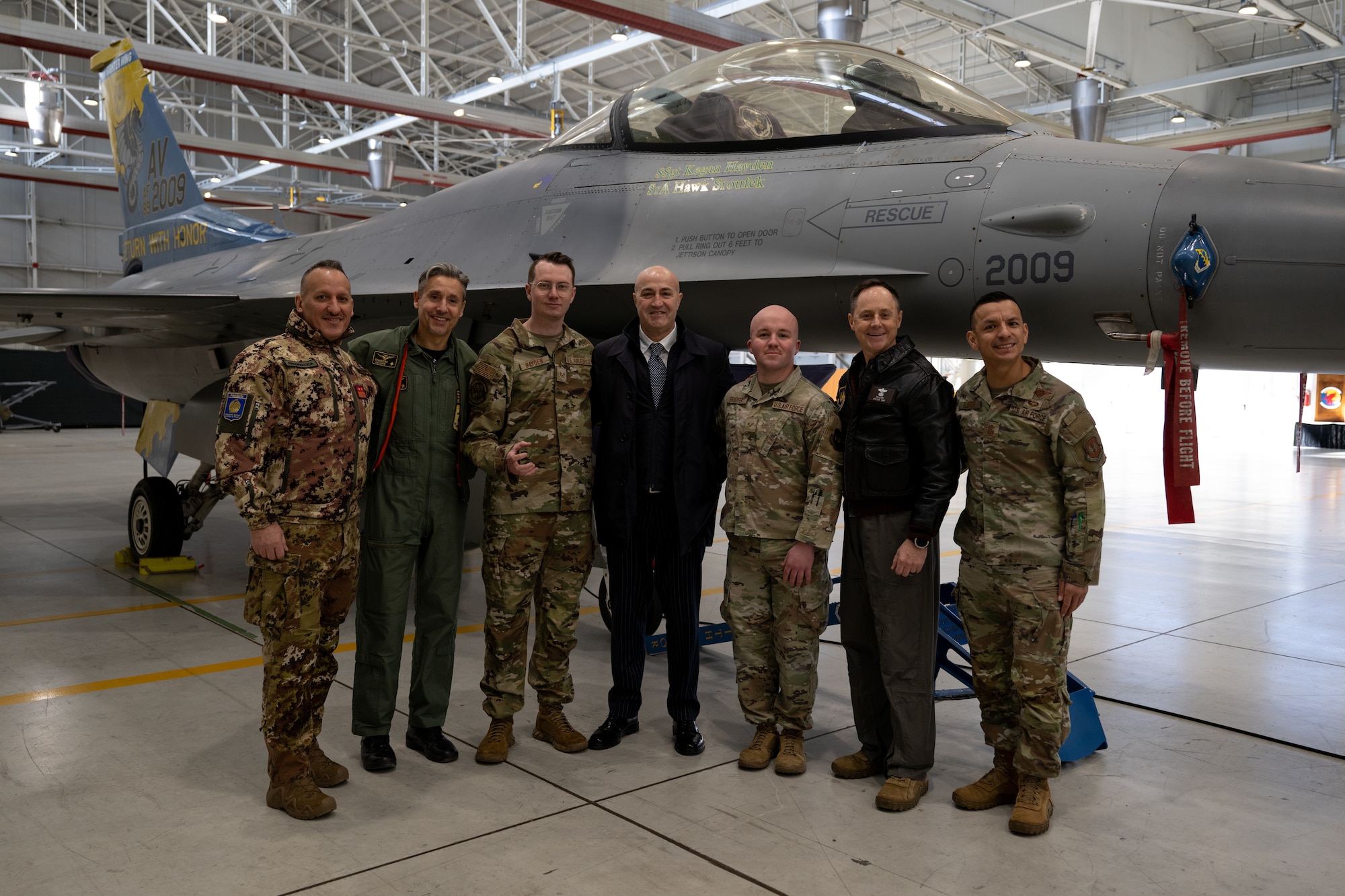 Prefect of Pordenone, Michele Lastella (center), poses with leadership and Airmen from Aviano Air Base, Italy, Jan. 14, 2025.
