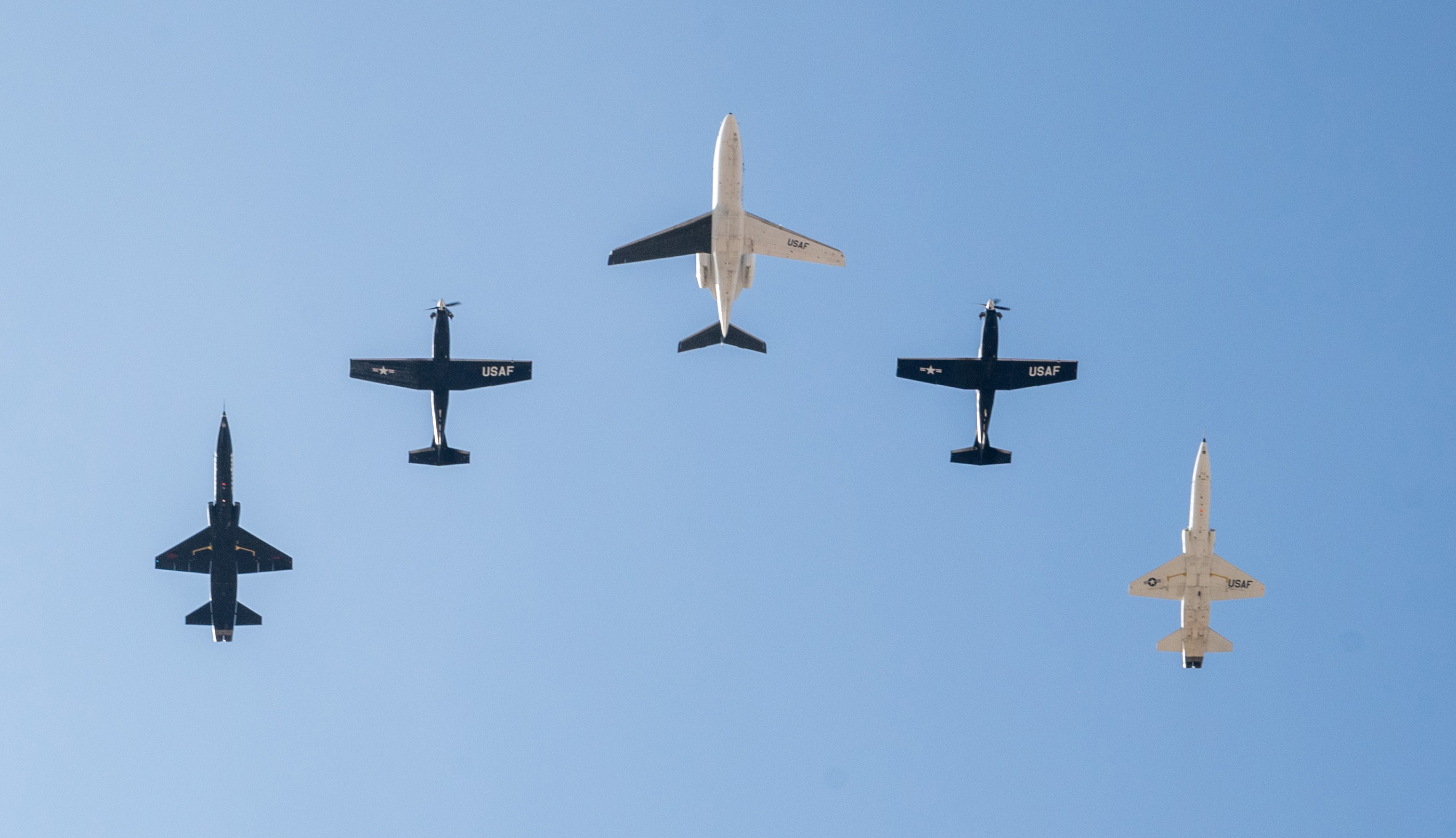 A five-ship formation, including the T-1A Jayhawk center, flies together at Laughlin Air Force Base, Texas, Dec. 17, 2024.