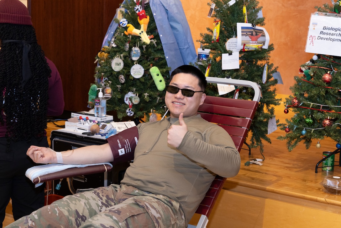 WRAIR held their quarterly blood drive in December of 2024. Pictured is a soldier donating blood giving the camera a thumbs up.